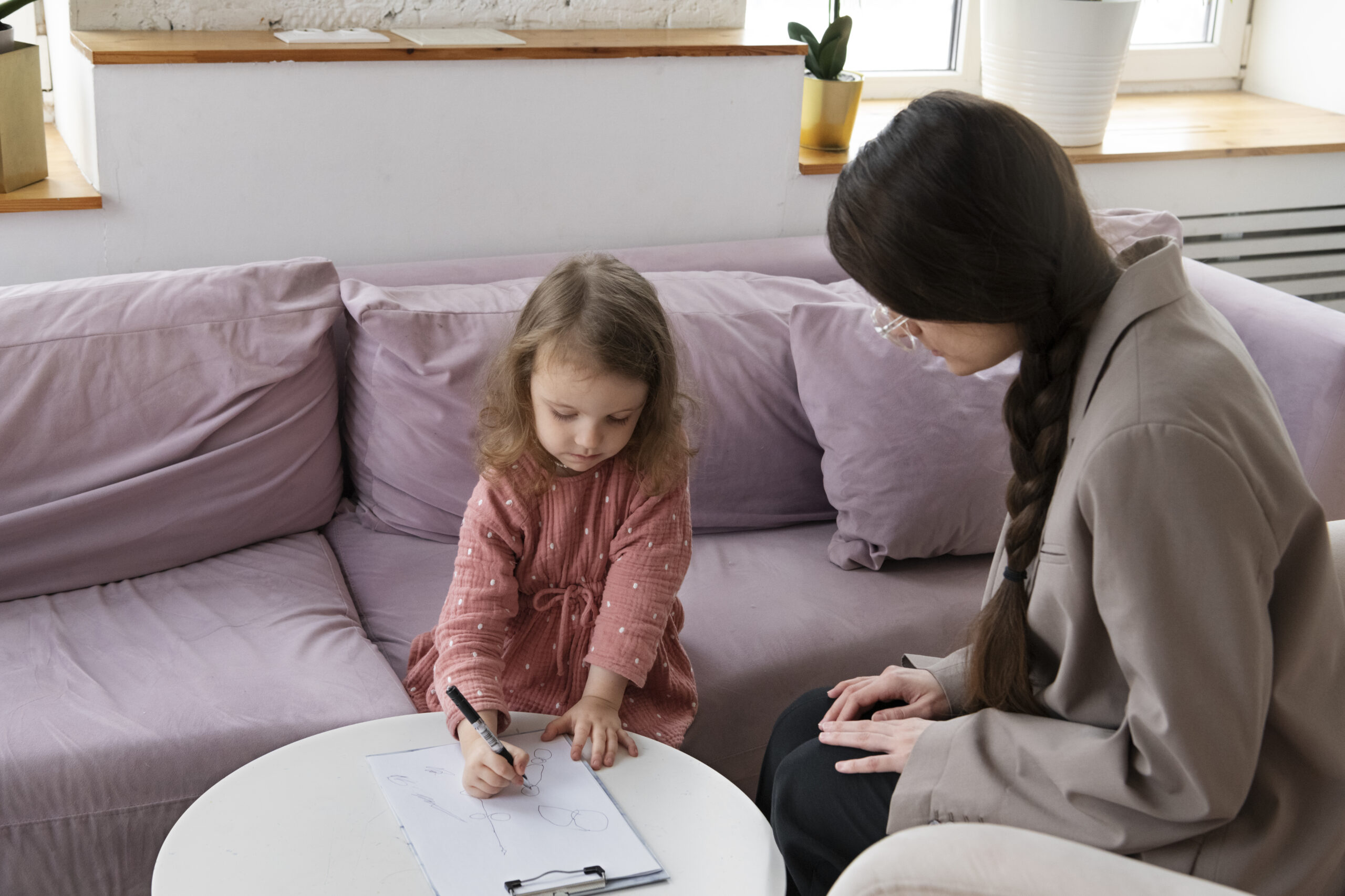 child-doing-therapy-session-with-psychologist
